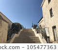 Blue sky looking up from the stairs 105477363