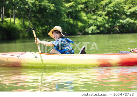 child enjoying kayaking child enjoying kayaking 105478758
