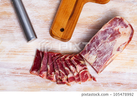 Lacon curado - Spanish national delicacy, jerky pork ham Lacon curado - Spanish national delicacy, jerky pork ham 105478992