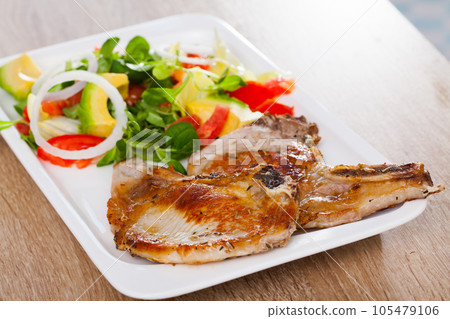 Pork chops with vegetable salad Pork chops with vegetable salad 105479106