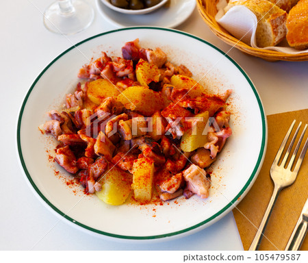 Galician-style octopus served on plate 105479587