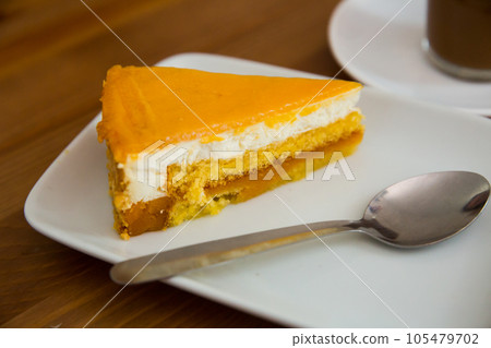 Cheesecake with mango glaze Cheesecake with mango glaze 105479702
