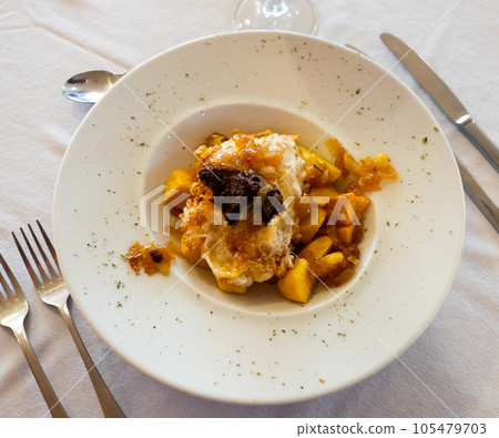 Huevos rotos con morcilla, scrambled eggs with blood sausage Huevos rotos con morcilla, scrambled eggs with blood sausage 105479703