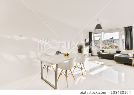 a living room with white flooring and large windows looking out onto the cityscapearl view from the dining area a living room with white flooring and large windows looking out onto the cityscapearl view from the dining area 105480164