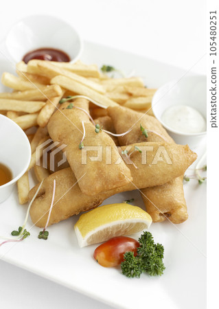british traditional fish and chips meal in restaurant on white plate british traditional fish and chips meal in restaurant on white plate 105480251