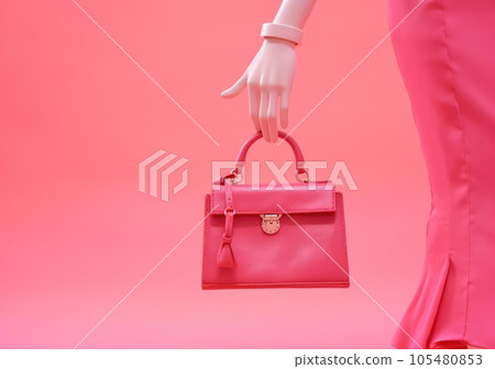 The doll is holding a handbag 105480853