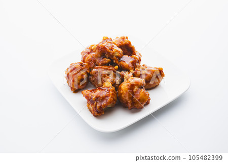 Yangnyeom chicken served on a white square plate Yangnyeom chicken served on a white square plate 105482399