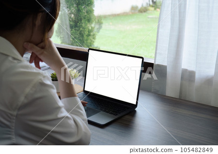 female using laptop monitor white blank empty mockup for workspace advertising female using laptop monitor white blank empty mockup for workspace advertising 105482849
