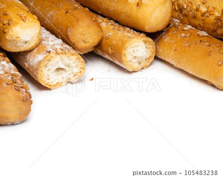 Sesame biscuits on a white background. Biscuits are elongated in the form of sticks. Bread Sesame biscuits on a white background. Biscuits are elongated in the form of sticks. Bread 105483238