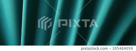 Waved green blue fabric as background closeup 105484059
