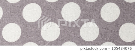 Gray and white fabric with polka dot pattern. 105484076