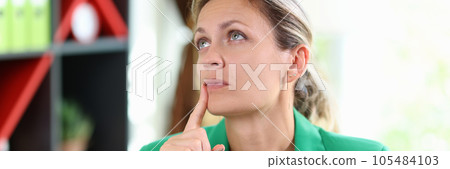 Female manager thinking with notebook and pen in hands. Female manager thinking with notebook and pen in hands. 105484103