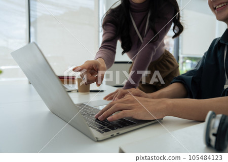 Businesspeople working and typing on laptop keyboard on laptop computer at office. 105484123