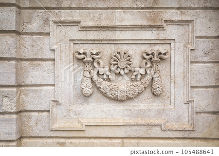 Exterior stone wall of Dolmabahce Palace with carved floral pattern ornaments, Besiktas district, Istanbul, Turkey Exterior stone wall of Dolmabahce Palace with carved floral pattern ornaments, Besiktas district, Istanbul, Turkey 105488641