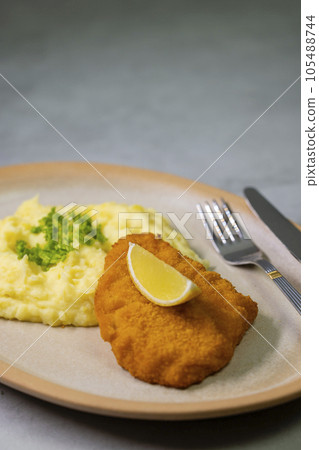 Typical Czech cuisine chicken cutlet with mashed potatoes Typical Czech cuisine chicken cutlet with mashed potatoes 105488744