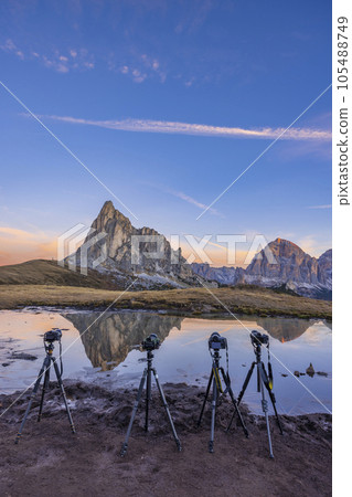 Camera on a tripod in the landscape, Giau Pass (Passo Giau), Dolomites Alps, South Tyrol, Italy 105488749