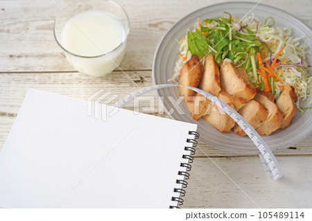 Think about a healthy diet plan Salad, chicken, milk, notebook and measure Think about a healthy diet plan Salad, chicken, milk, notebook and measure 105489114