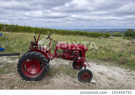 Red tractor near Monbazillac castle (Chateau de Monbazillac), Dordogne department, Aquitaine, France 105489792