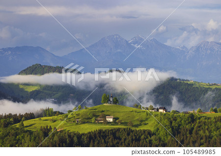 Landscape with St. Thomas Church (Cerkev Sveti Tomaz) near Skofja Loka, Slovenia 105489985