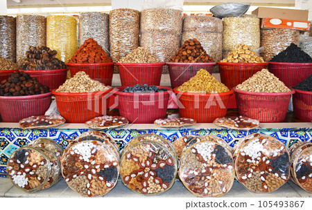 Neatly displayed dried fruits and nuts at Uzbekistan market 105493867
