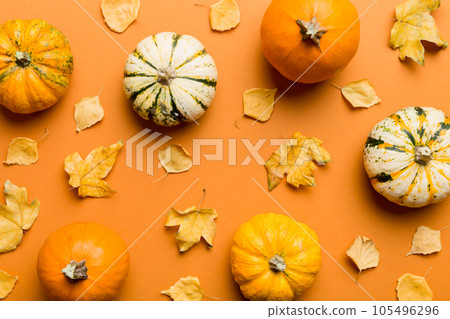 Autumn composition. Pattern made of dried leaves and other design accessories on table. Flat lay, top view 105496296