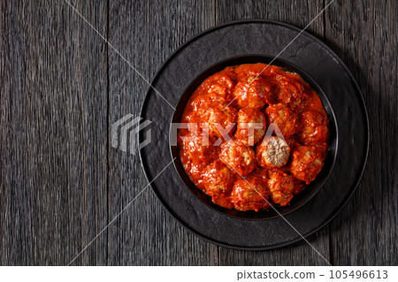 Iowa Ham Balls with tomato sauce in bowl Iowa Ham Balls with tomato sauce in bowl 105496613