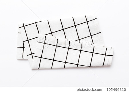 top view with white empty kitchen napkin isolated on table background. Folded cloth for mockup with copy space, Flat lay. Minimal style 105496810