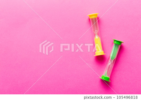 hourglass on the table, sand clock as time passing concept for business deadline, copy space hourglass on the table, sand clock as time passing concept for business deadline, copy space 105496818