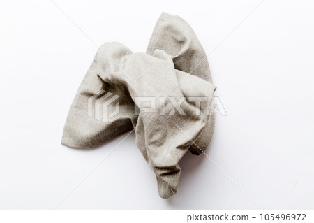 top view with gray kitchen napkin isolated on table background. Folded cloth for mockup with copy space, Flat lay. Minimal style 105496972