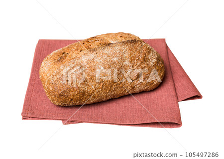 Freshly baked delicious french bread with napkin isolated on white background top view. Healthy white bread loaf Freshly baked delicious french bread with napkin isolated on white background top view. Healthy white bread loaf 105497286