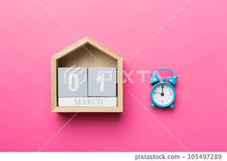 March 1st. Image of March 1 wooden block calendar on colored background. Summer day. Empty space for text 105497289
