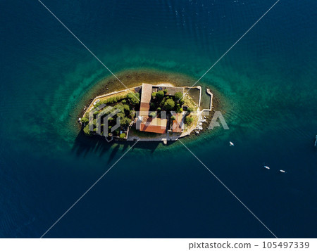 Aerial view of Our Lady of the Rocks or Gospa od Skrpjela and Catholic monastery Saint George in the bay of Kotor, in city of Perast, Adriatic sea, Montenegro. Tourism destination Aerial view of Our Lady of the Rocks or Gospa od Skrpjela and Catholic monastery Saint George in the bay of Kotor, in city of Perast, Adriatic sea, Montenegro. Tourism destination 105497339