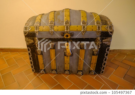 Very old box in the attic like pirate treasure box.High dynamic range image. Pakruojis manor, Lithuania Very old box in the attic like pirate treasure box.High dynamic range image. Pakruojis manor, Lithuania 105497367