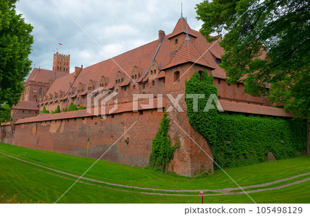 Castle of the Teutonic Knights Order in Malbork, Poland,  is the largest castle in the world. Malbork Poland. 105498129