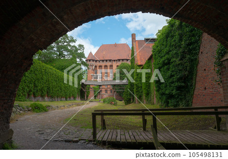 Castle of the Teutonic Knights Order in Malbork, Poland,  is the largest castle in the world. Malbork Poland. 105498131