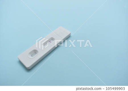 covid test kit on blue background covid test kit on blue background 105499903