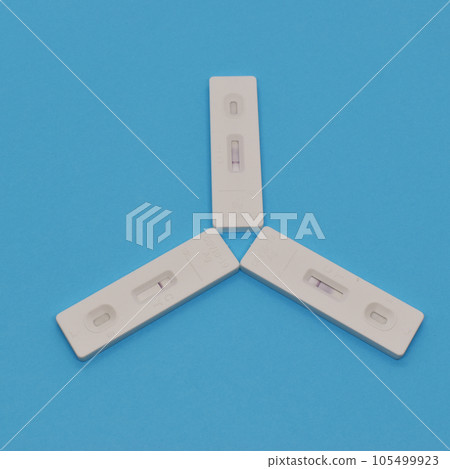 covid test kit on blue background covid test kit on blue background 105499923