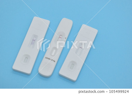 covid test kit on blue background 105499924