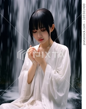 Young woman being hit by a waterfall 105501400