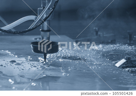 Close-up scene of multi-axis abrasive waterjet cutting machine cutting the aluminum plate. 105501426