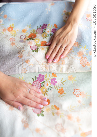 person holding a kimono person holding a kimono 105501556