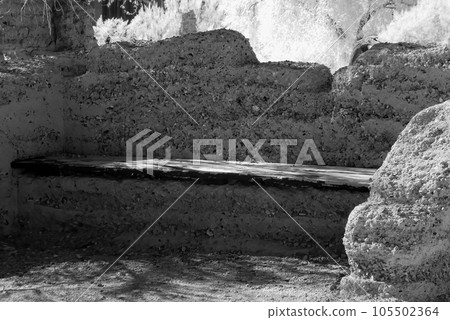 Old Bench Against an Adobe Wall Old Bench Against an Adobe Wall 105502364