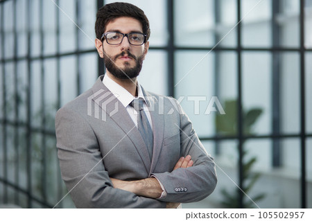 Portrait of serious handsome successful businessman in glasses and suit. Portrait of serious handsome successful businessman in glasses and suit. 105502957