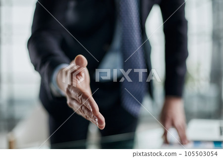 Close up agent reach out hand to camera handshake client. Close up agent reach out hand to camera handshake client. 105503054