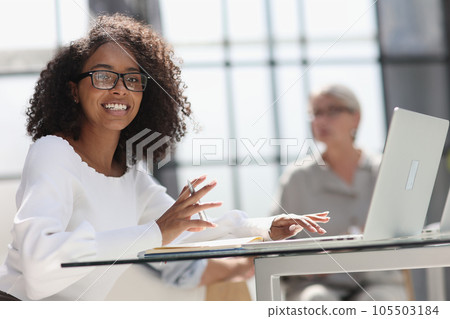 young attractive african american woman in the office young attractive african american woman in the office 105503184