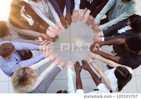 Friends with stack of hands showing unity and teamwork. Friends with stack of hands showing unity and teamwork. 105503707