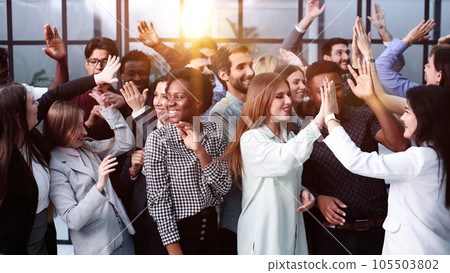 Supporters clapping at political gathering in the office 105503802
