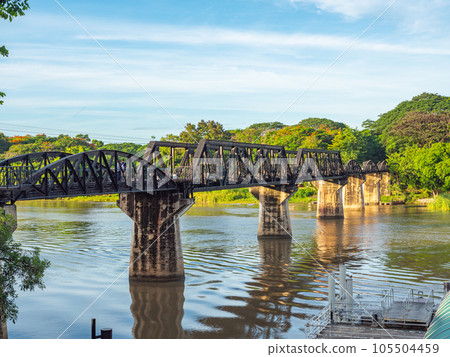 The train is passing through the Death Railway Bridge over the River Kwai in Kanchanaburi.  During World War Two Japan constructed railway from Thailand to Burma This is now know the Death Railway. 105504459