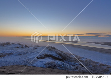 Panorama over the beach of the Danish coastal resort of Blavand at sunrise Panorama over the beach of the Danish coastal resort of Blavand at sunrise 105505305