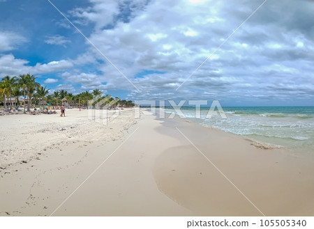 View over a tropical beach with turquoise blue water during the day View over a tropical beach with turquoise blue water during the day 105505340